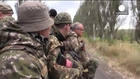 Ukrainian army and rebel troops pull back to create buffer zone