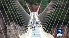 China glass bottom bridge engineers invite the brave to test its safety