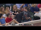 Young fan gives decoy ball to pretty lady