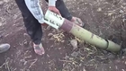 Syrian citizens work to remove an unexploded assad crime dynasty Grad rocket: Quneitra Governorate