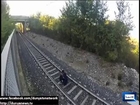 Italian Boy do a very dangerous sprand in the Speedy Train Tracks over him watch video
