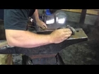 Bill Moffet lights a fire with cold steel and a hammer